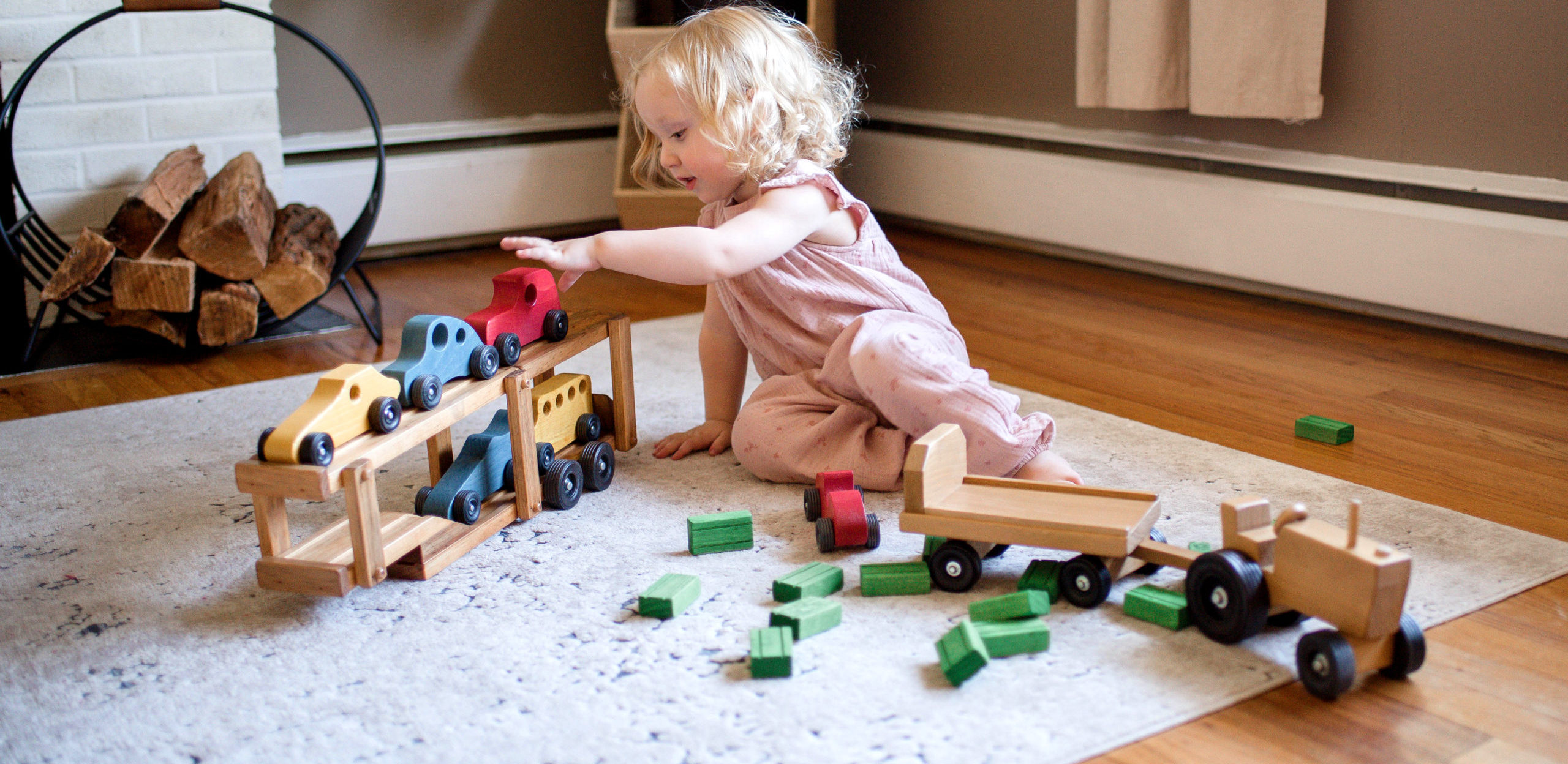 Young Girl playing with Truck Car Carrier